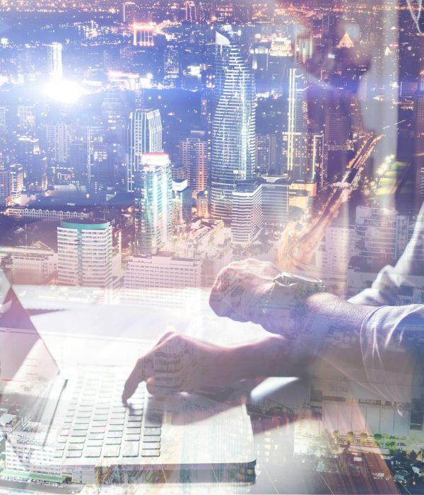 Close-up of male hands using laptop in home.